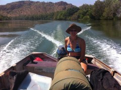Tracey pilots the boat up the Ord River, WA - [Click for a Larger Image]