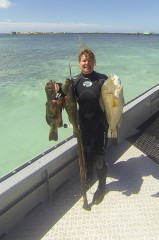 Tracey with two Coral Trout and a Groper - [Click for a Larger Image]